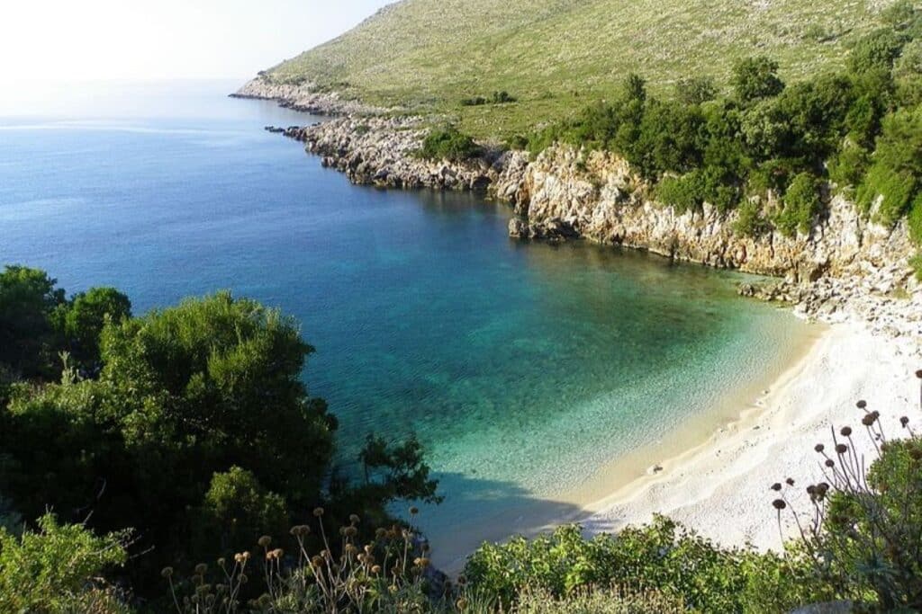 Karaburun Peninsula in South Albania, with rugged cliffs and serene, clear waters.