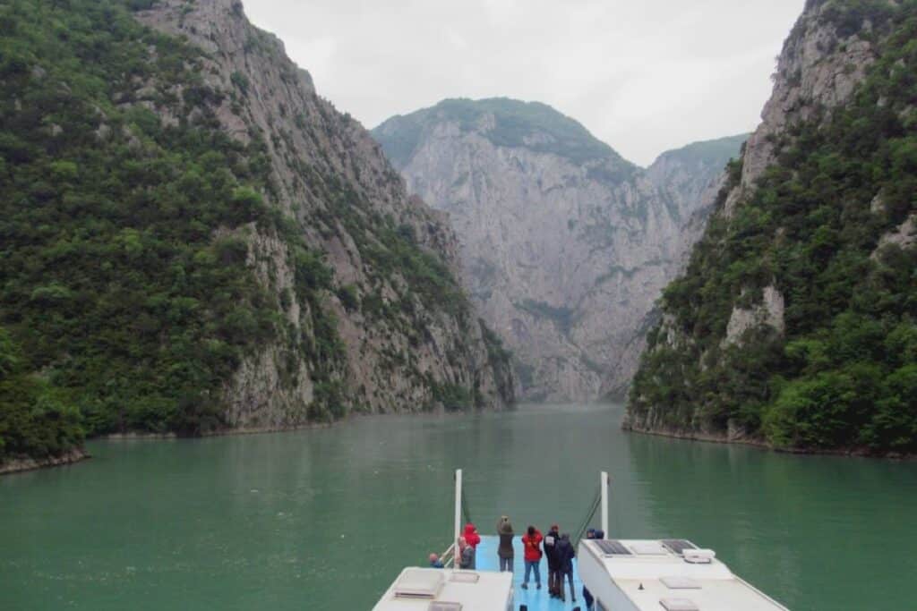 The Lake Koman Ferry, one of Albania’s most scenic transportation routes, gliding through stunning mountain landscapes.