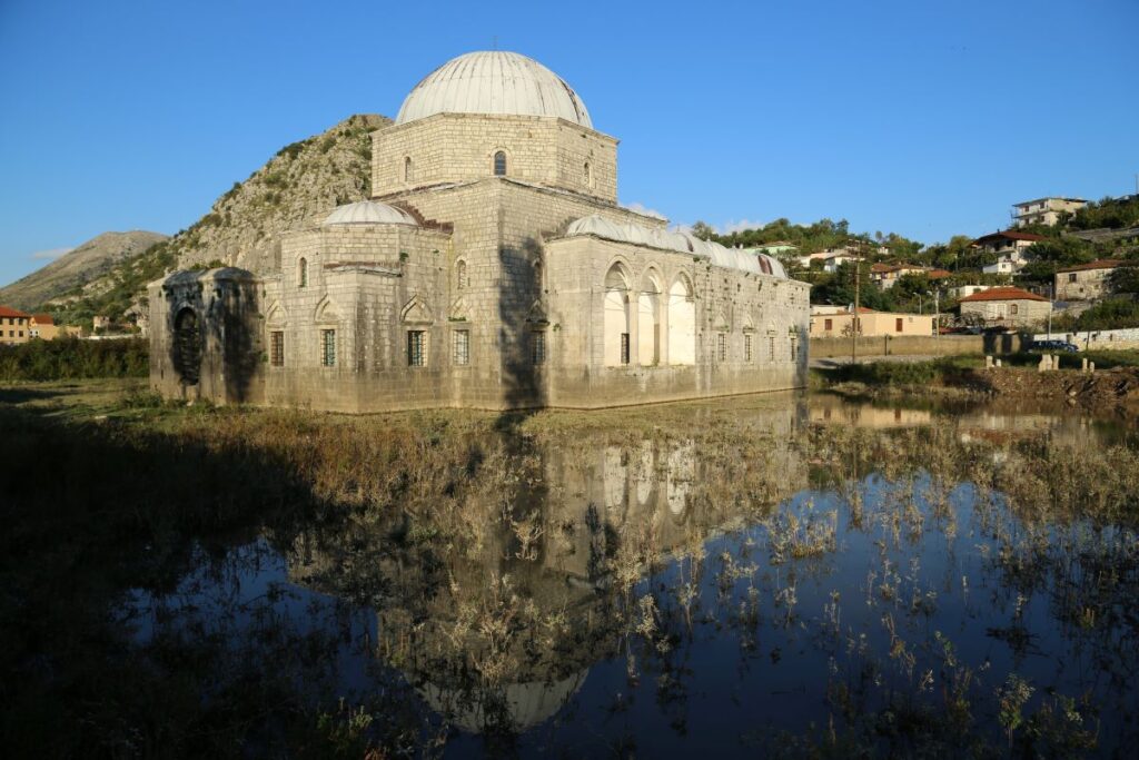 The Lead Mosque in Shkodër, Albania, with its Ottoman architecture and mountainous surroundings.