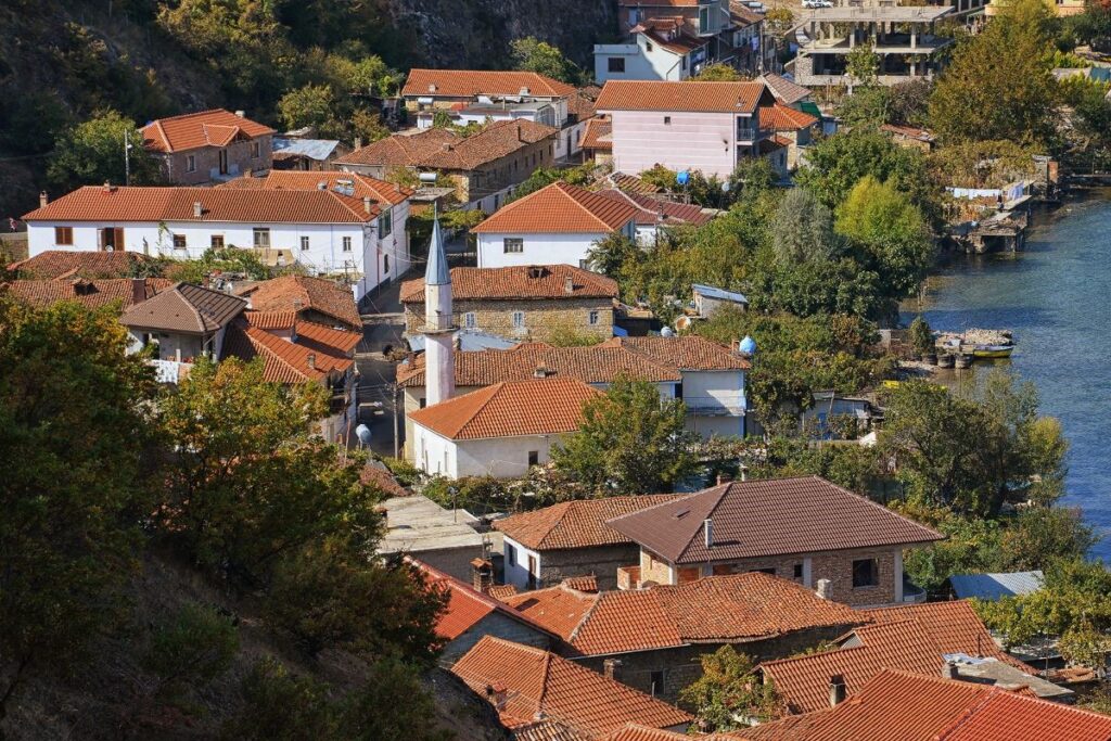 Lin Village on the shores of Lake Ohrid, with traditional houses and serene lake views.