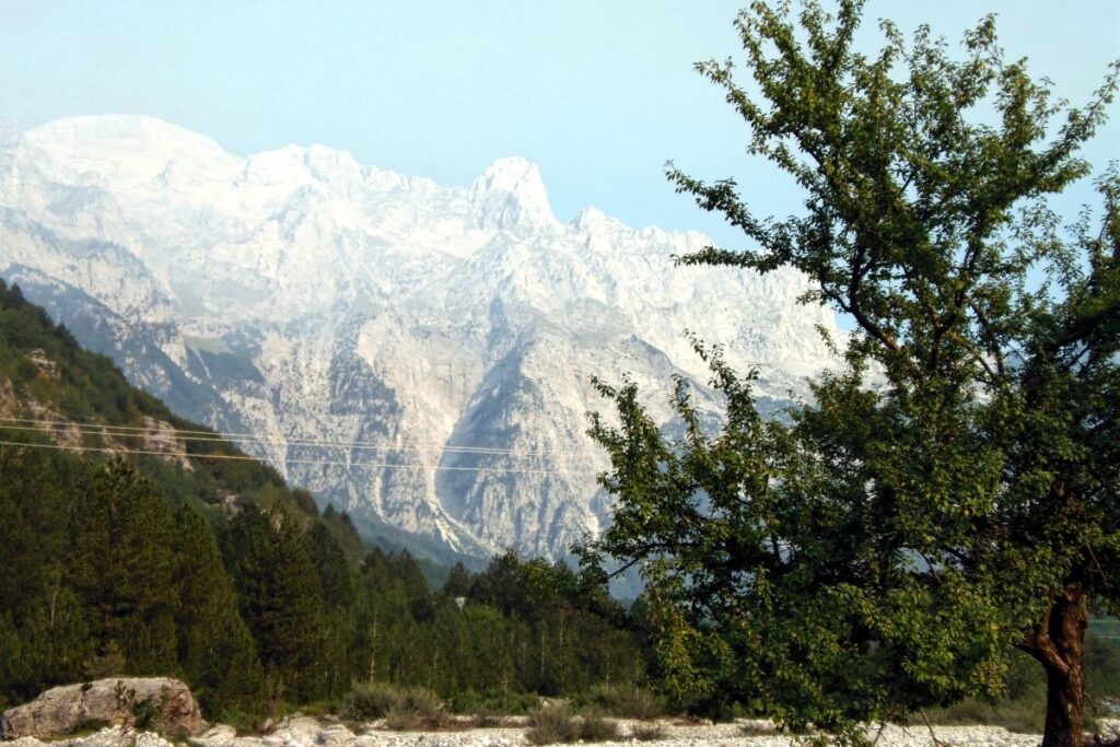 The picturesque village of Theth in North Albania, blanketed in snow during winter.