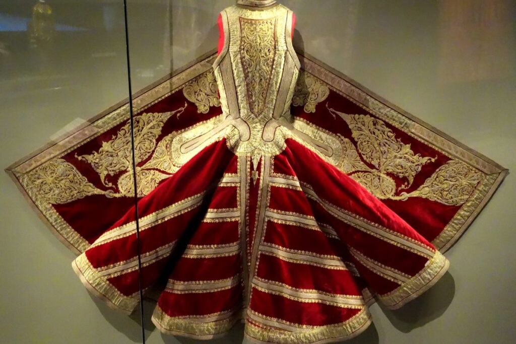 Traditional Albanian red and gold ceremonial robe with intricate embroidery