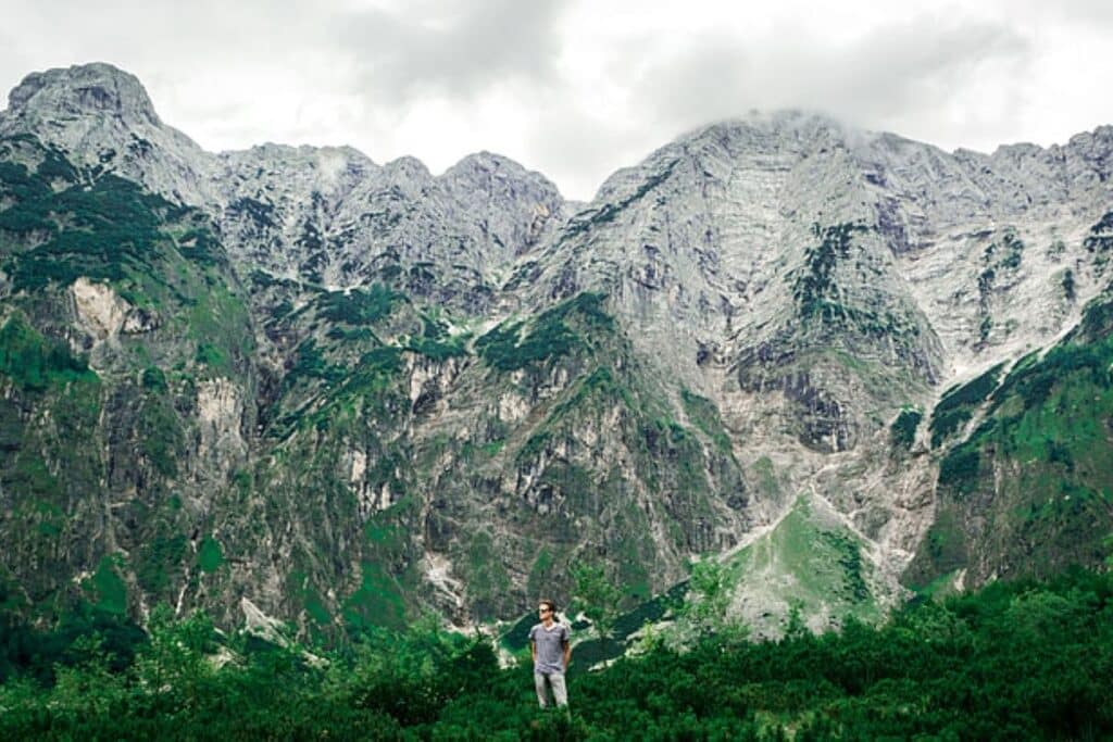 Hikers crossing the Valbona Pass on the iconic Theth to Valbona Trail in Albania.