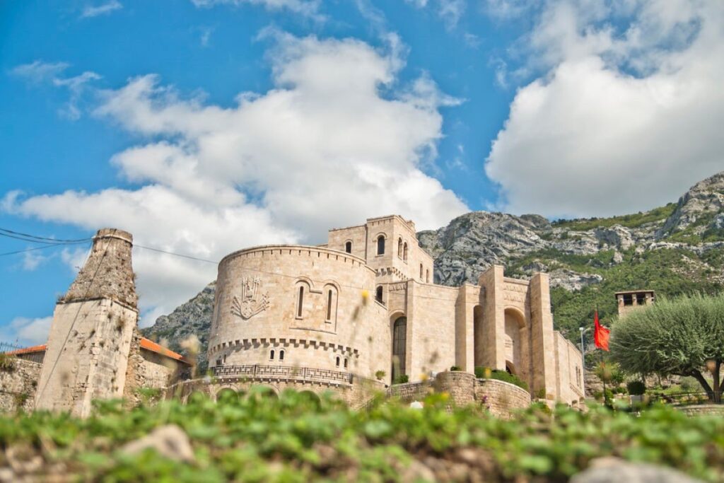 The historic Kruja Castle in Central Albania, surrounded by mountains and scenic landscapes.