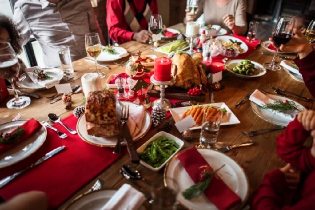 A traditional Albanian New Year’s table with Gjeli Detit and candles for good luck.